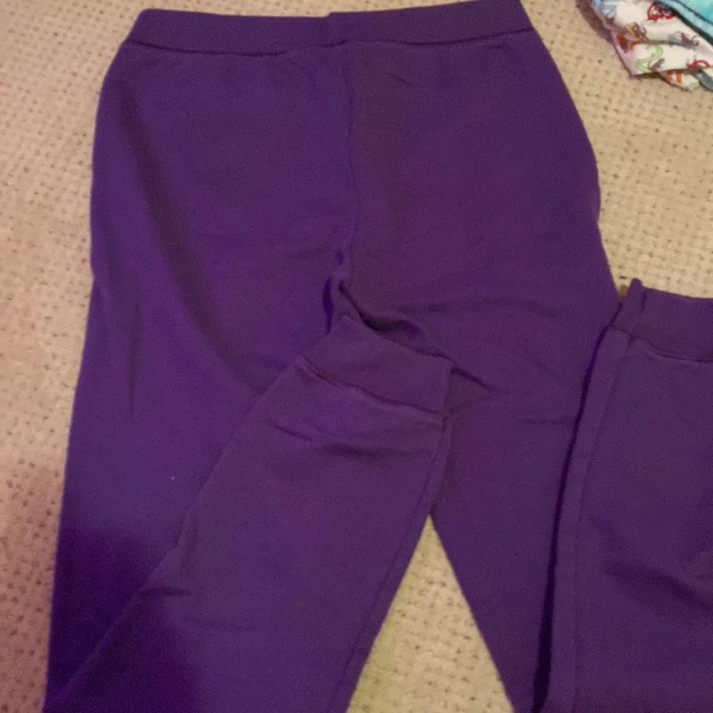 Purple sweatpants above the ankle